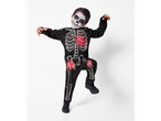 Boy in a black skeleton costume with red blood splatters and skeleton face paint.