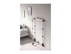 White clothes drying rack with multiple tiers in a modern living room setting.