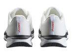 Pair of white and black athletic shoes with red text on the heel.