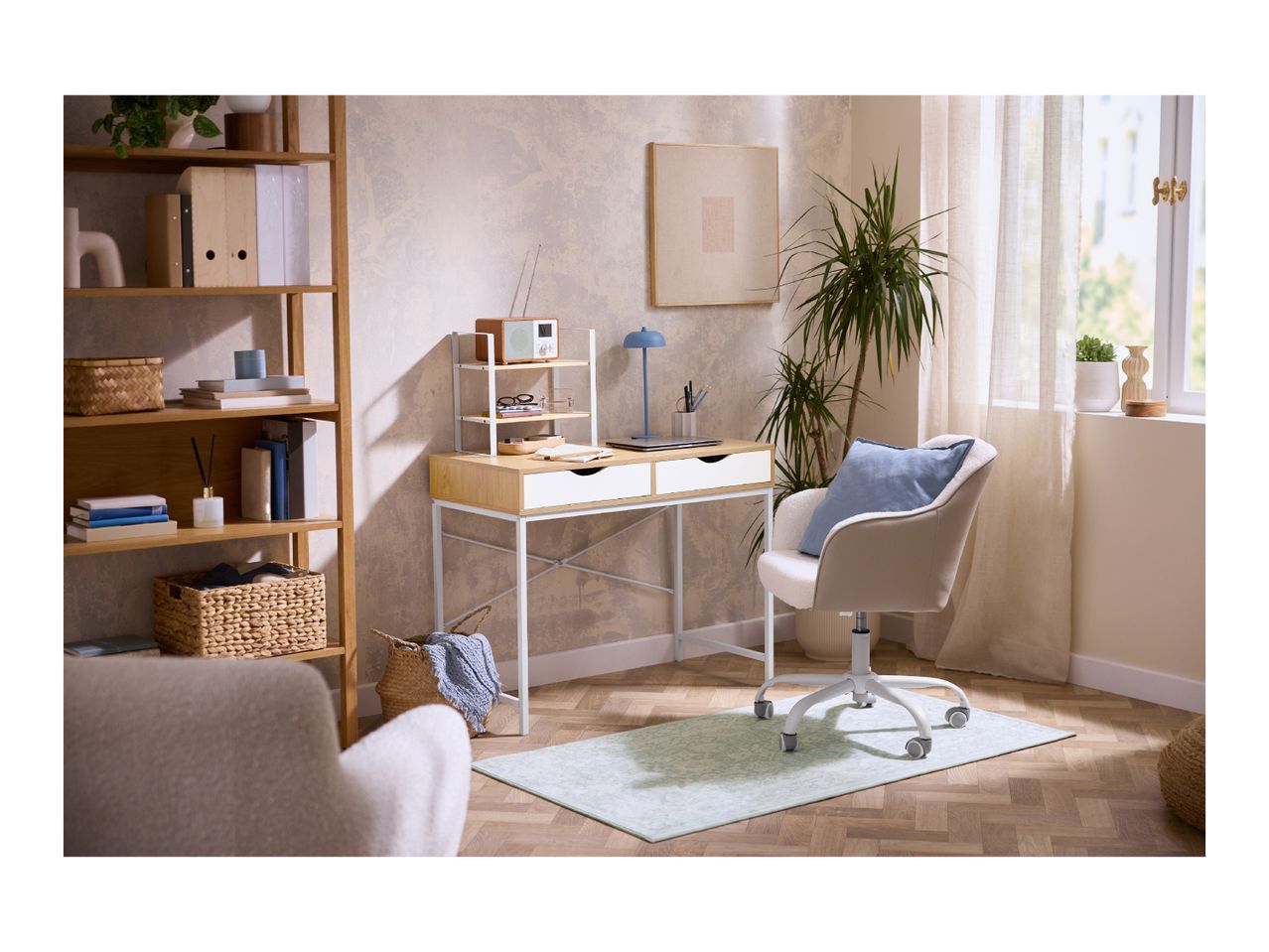 Home office with a wooden desk, white chair, and a tall wooden bookshelf.