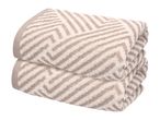 Two folded beige and white patterned towels stacked on top of each other.