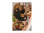Sandwich maker with toasted sandwiches, waffle plates, and fresh ingredients on a kitchen counter.