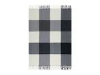 Black, grey, and white checkered blanket with fringe