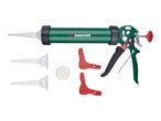 A green caulking gun with a red plunger and black handle, accompanied by several white nozzles and red shaping tools.