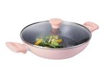 Pink wok with a glass lid, filled with vegetables.