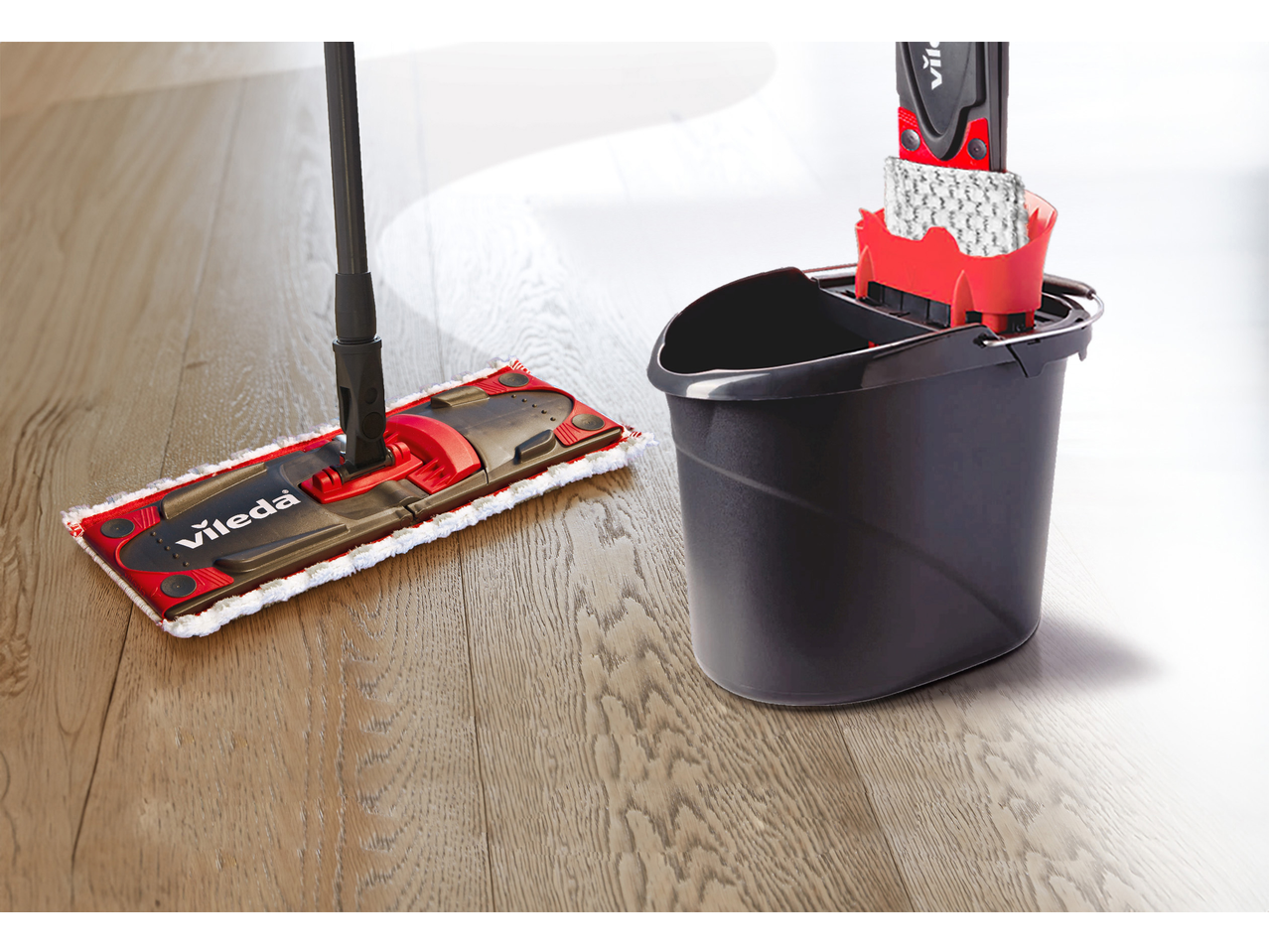 Vileda Ultramax mop and bucket set on a wooden floor.