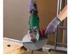 Person using an angle grinder to cut metal, sparks flying.