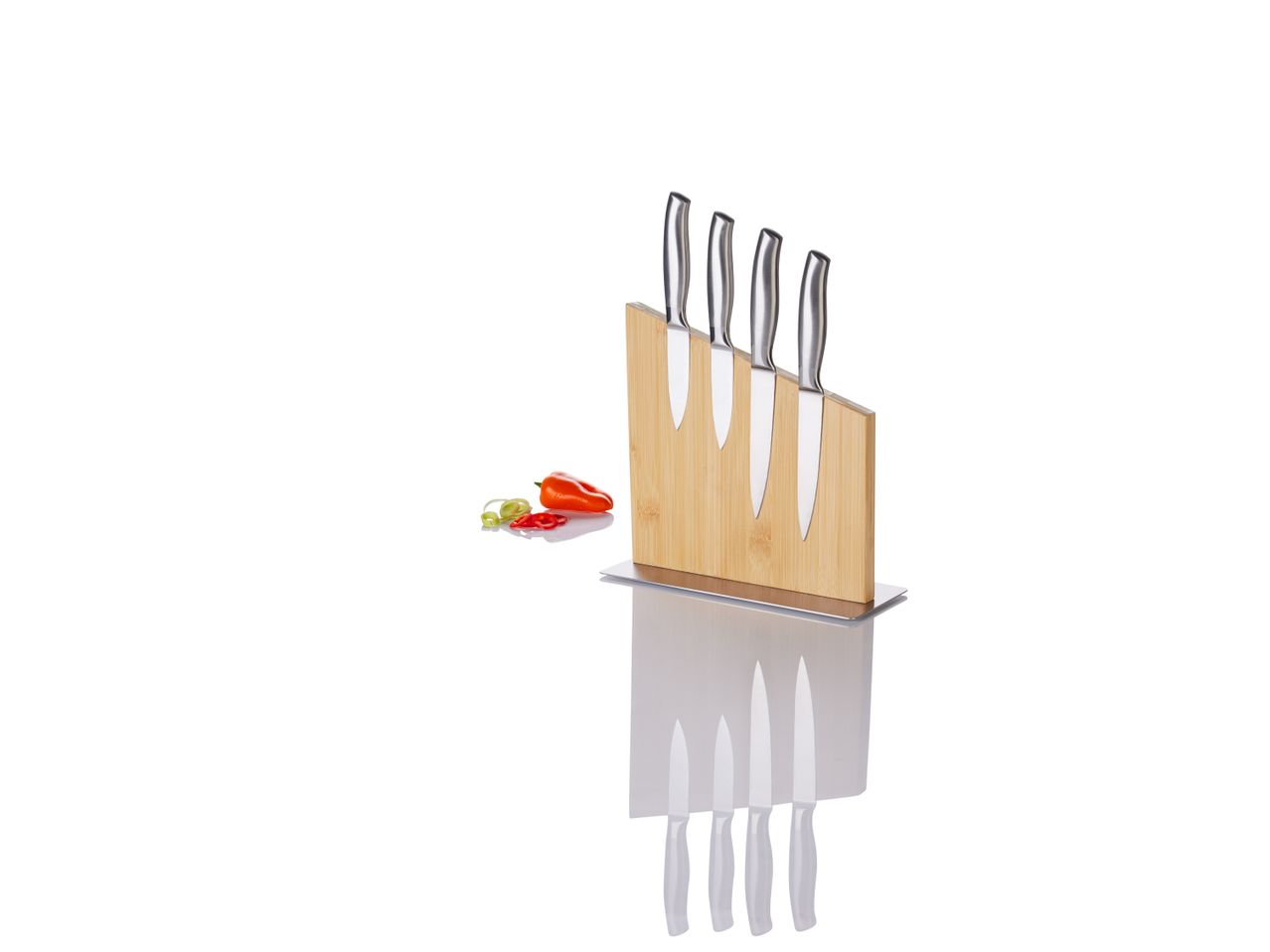 Knife block with four knives and sliced peppers on a white background