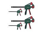 Two sets of green and red bar clamps, each set containing one large and one small clamp.