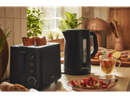 Silvercrest toaster and kettle on kitchen counter with breakfast food.