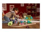 A child plays with a wooden train set featuring a Ferris wheel and carousel.