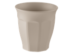 A single, light beige ceramic cup with a fluted design, viewed from an angle.