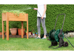 Parkside® Hose Reel in use, watering a raised garden bed with a person in the background.