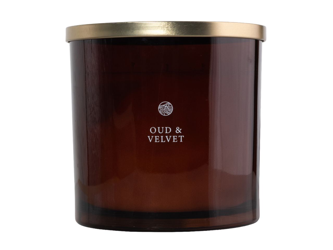 Oud & Velvet scented candle in a brown glass jar with a gold lid