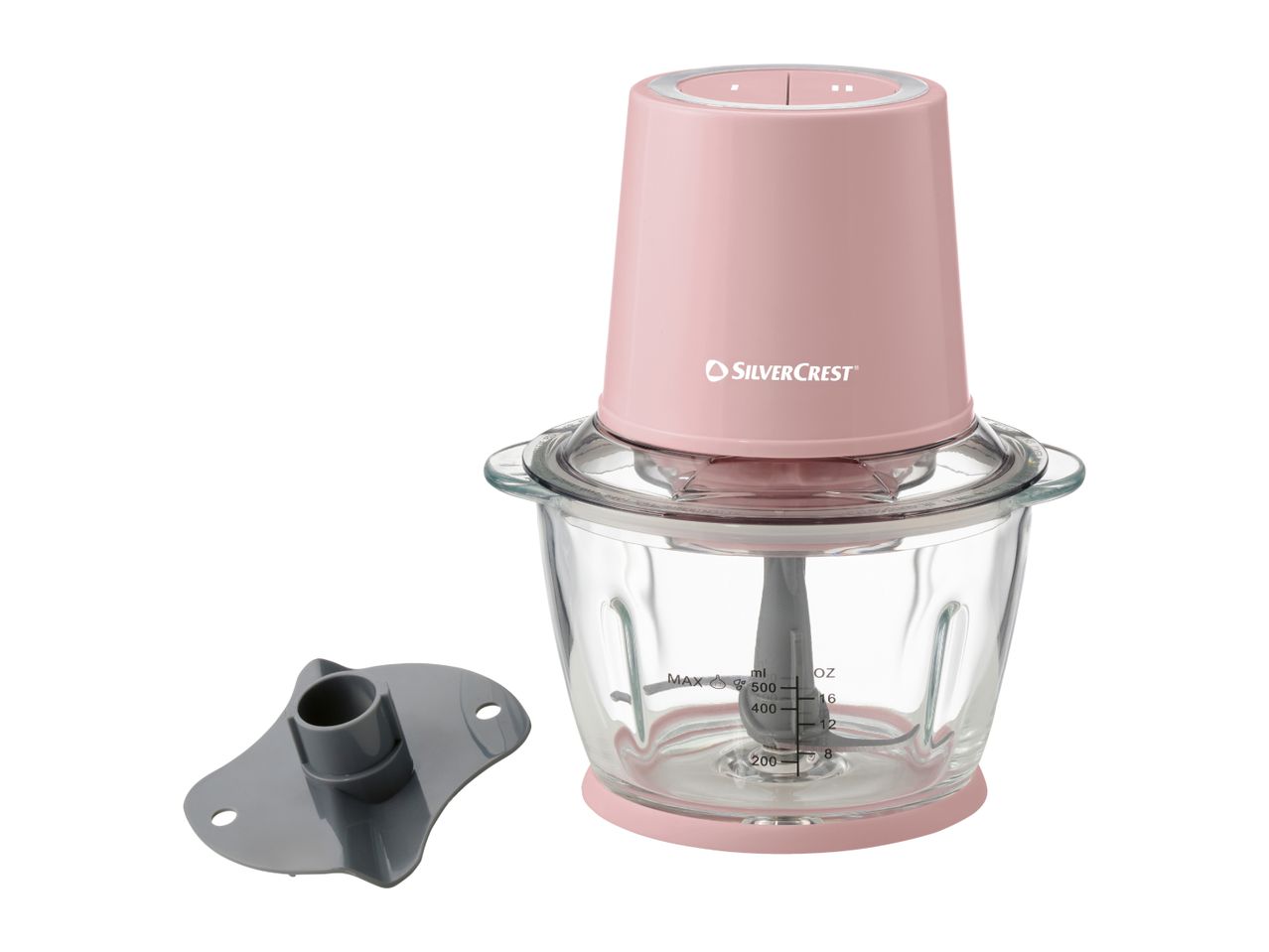 Pink electric food chopper with a glass bowl and a grey spatula on a white background.