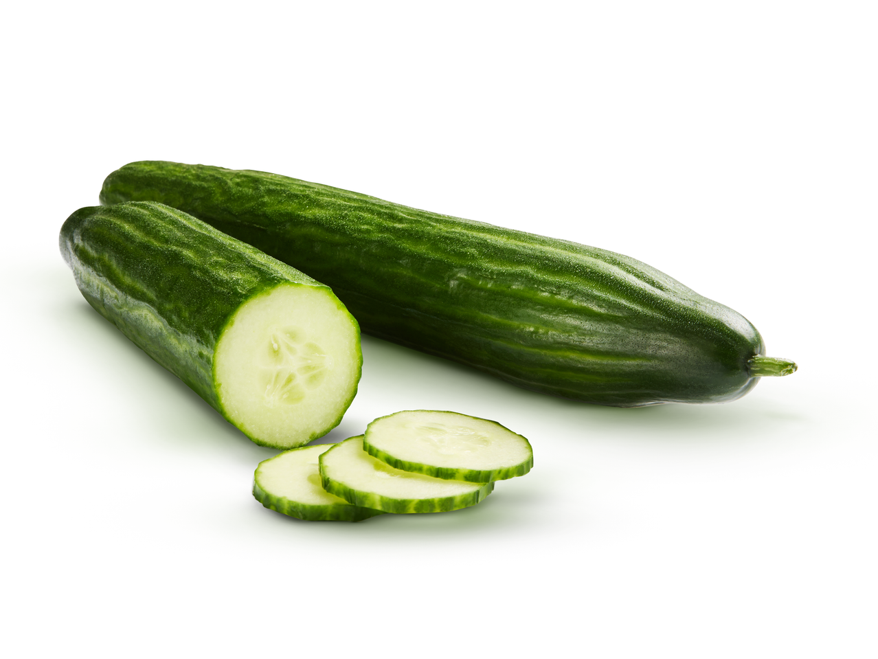 Two fresh cucumbers, one whole and one sliced, on a white background.