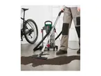 Parkside wet and dry vacuum cleaner cleaning dirt from a floor next to a bicycle