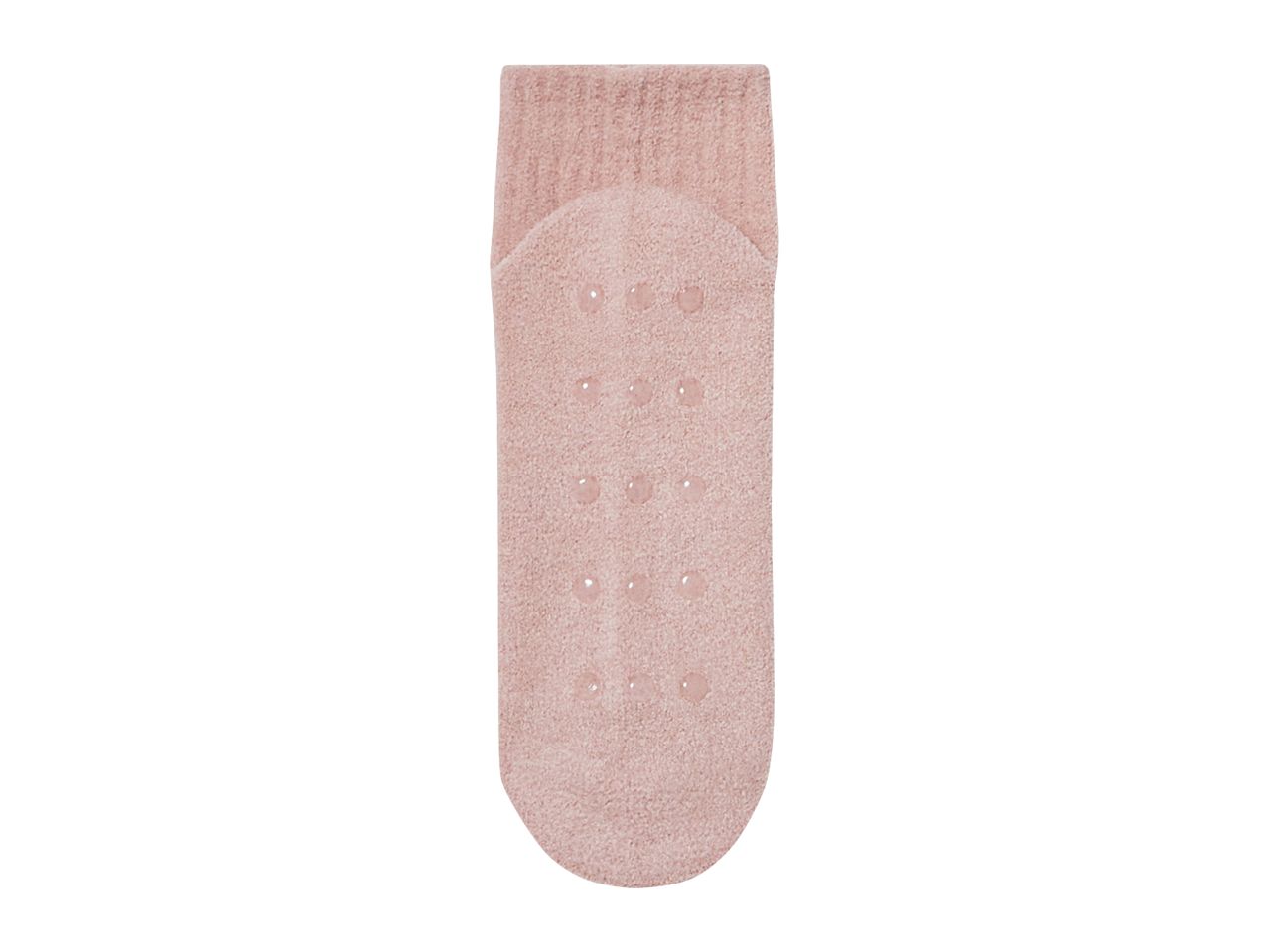 A single pink fuzzy sock with non-slip grips on the sole.