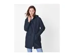 A woman in a navy blue hooded raincoat and jeans.