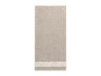 Beige towel with a decorative patterned border at the bottom.