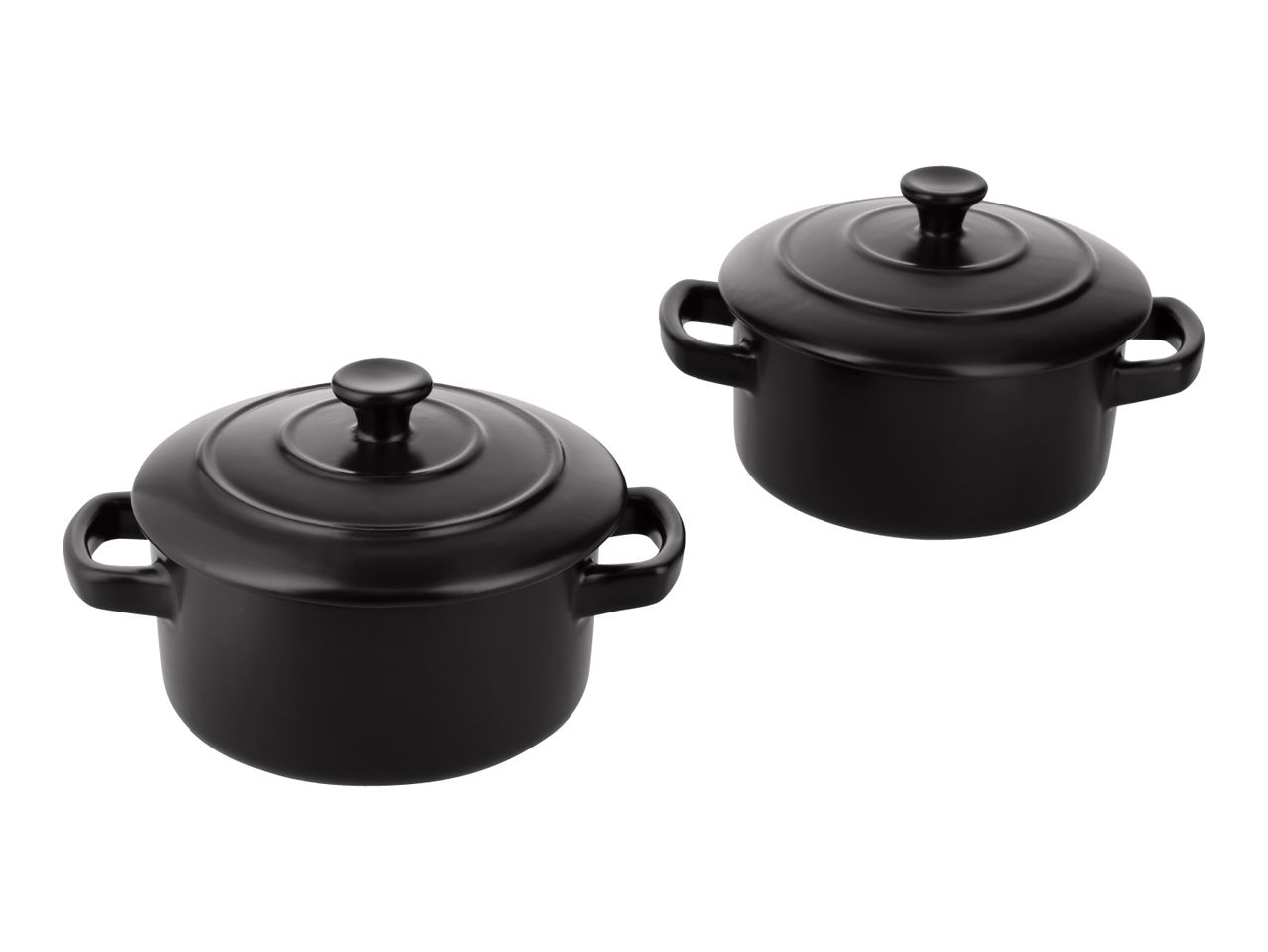 Two black ceramic mini casserole dishes with lids and handles.