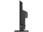 Side view of a black flat-screen television on a stand.