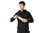 Man in a black hoodie and sweatpants holding a silver water bottle.
