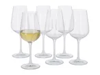 Six clear stemmed wine glasses, one filled with white wine, on a white background.