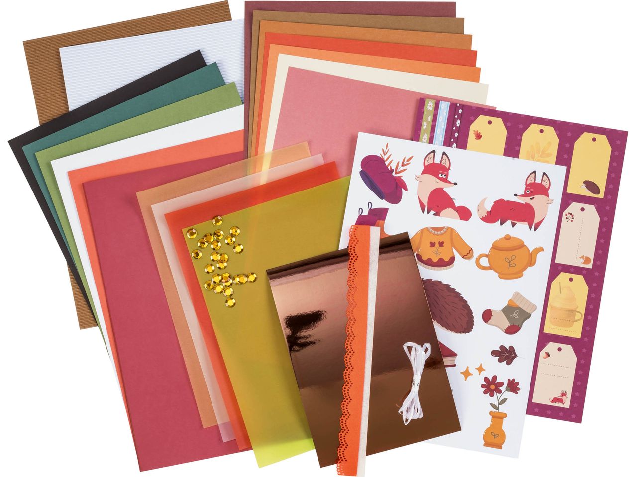 Un set di materiali per scrapbooking a tema autunnale con carte, abbellimenti e adesivi.