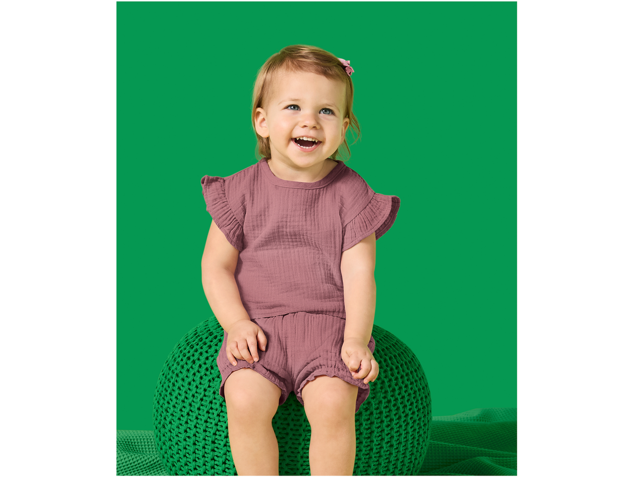 Set muselină LUPILU pentru fetițe: bebeluș zâmbitor într-un costum roz.