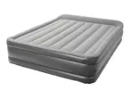 A gray inflatable air mattress with horizontal ridges on the top surface.