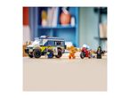 Toy police van, police officer, prisoner, and motorcycle with a female figure.