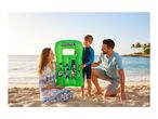 Family on a beach with a green inflatable pool float featuring pixelated characters.