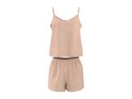 Light pink textured pajama set with a ruffled camisole top and elasticated shorts.