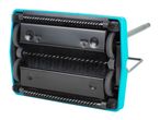 A teal carpet sweeper with black brushes and wheels is shown from the bottom.
