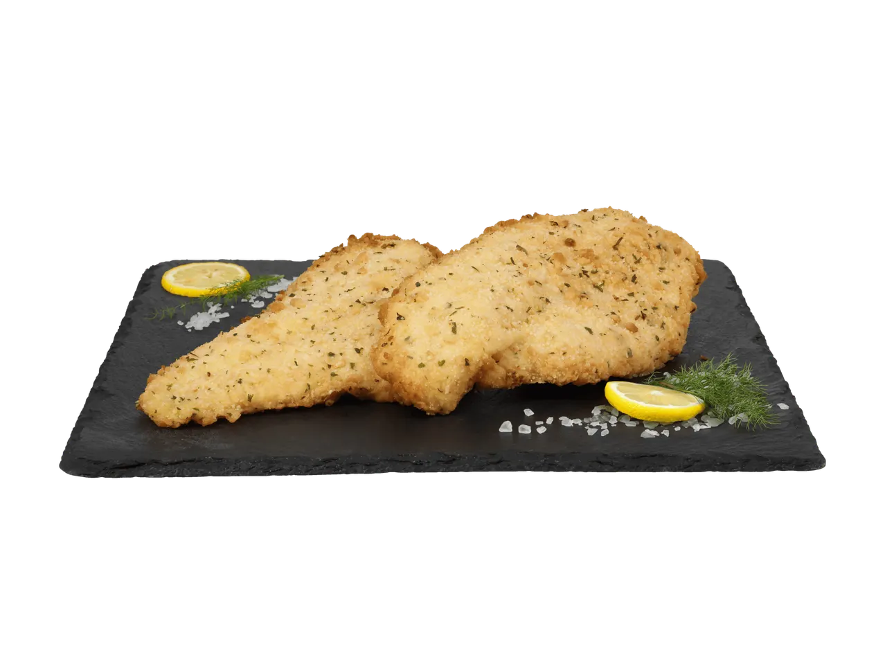 Zwei panierte Schnitzel mit Zitrone, Dill und Meersalz auf einer schwarzen Schieferplatte.