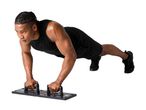 Man doing push-ups on a multi-functional push-up board.
