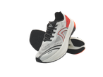 Crivit running shoes in white, black, and red, with a textured sole.