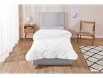 Bed with white duvet in a bright bedroom.