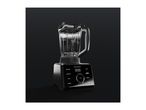Modern black blender with a digital display and glass jug on a dark background.