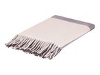 White and grey throw blanket with fringe