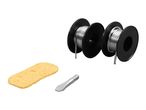 Two spools of solder wire, a soldering iron tip, and a cleaning sponge for soldering.