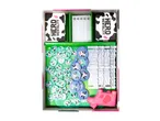 Board game box with cow-themed cards, tokens, fences, and a pink cow toy.