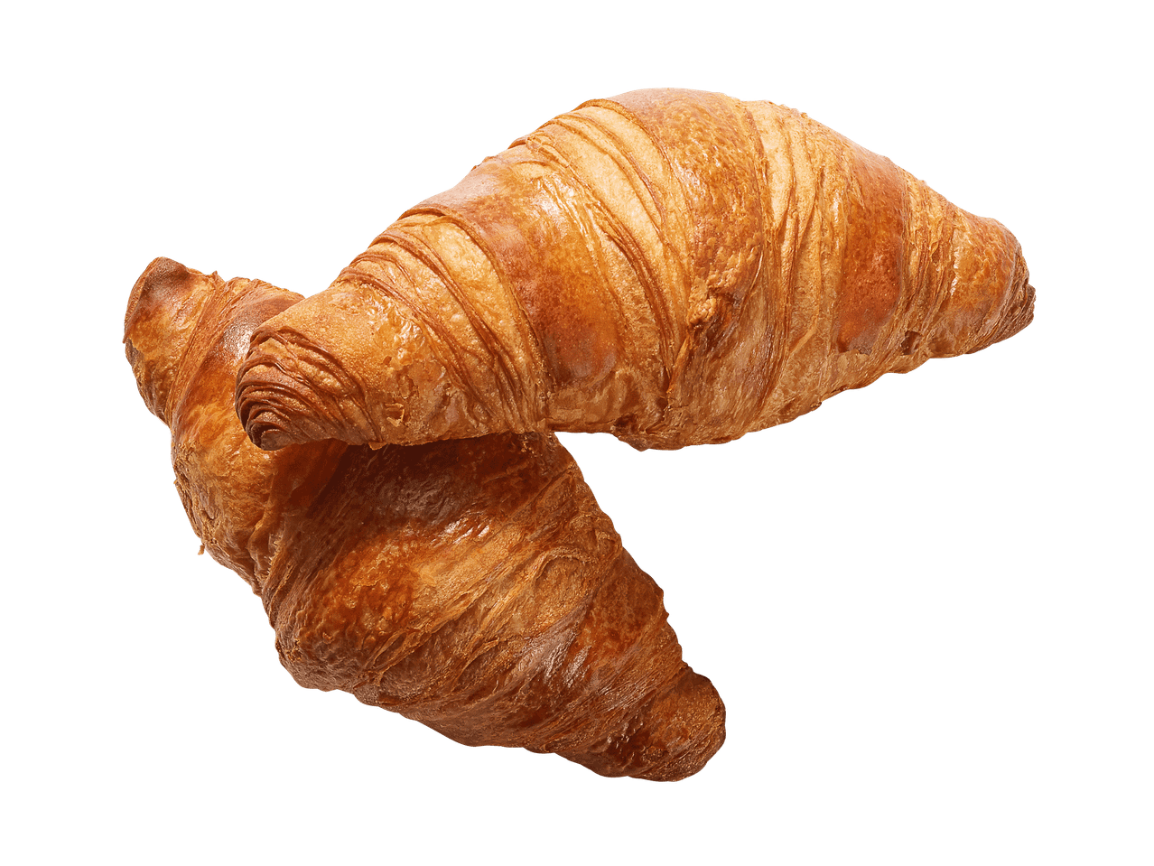 Due croissant dorati su un pezzo di tela di sacco.