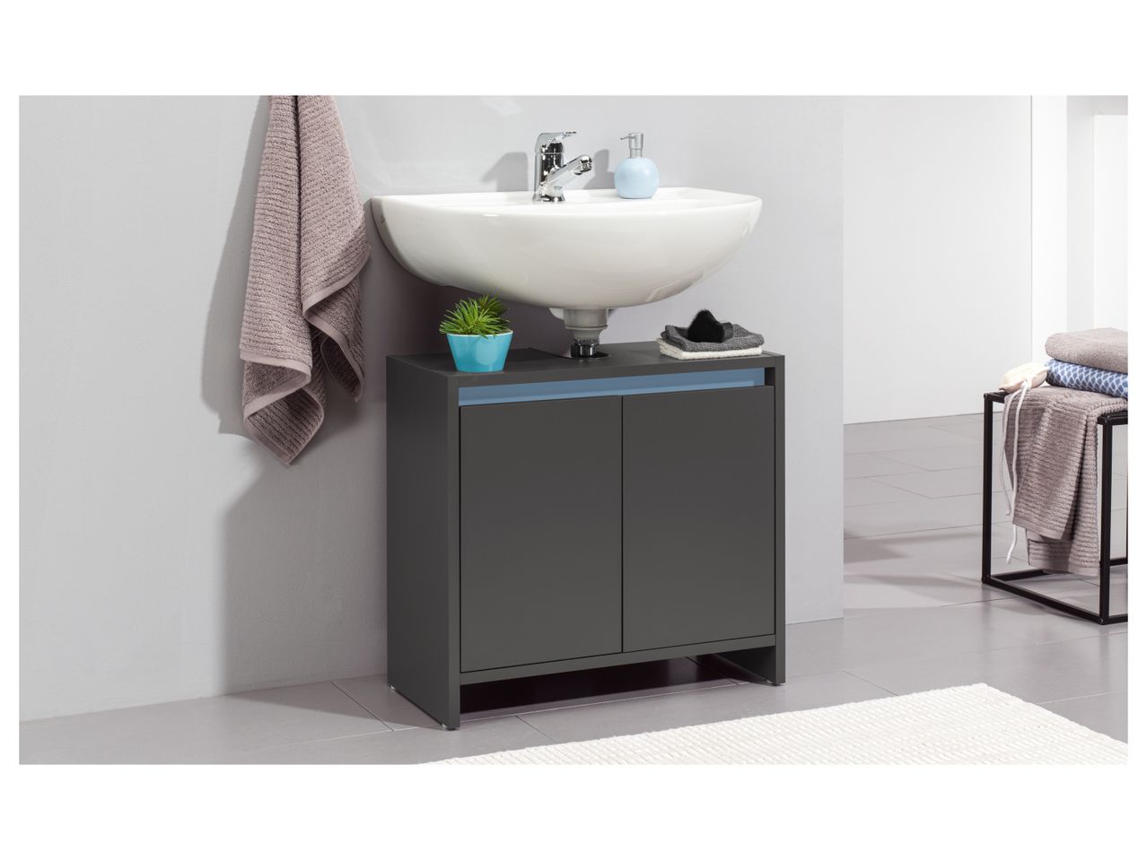 Modern dark gray bathroom Under Sink Storage Unit with a white countertop sink, featuring a minimalist design.