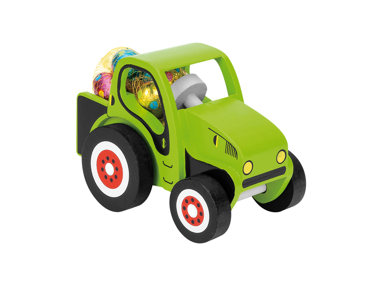 Drvena igračka traktor sa čokoladnim uskršnjim jajima.