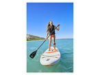 Woman paddleboarding on a Crivit SUP.
