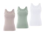 Tre basis tanktops i beige, lysegrøn og hvid.