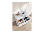 White chest of drawers with open drawers, organized with clothes and accessories.
