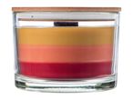 Layered candle in a glass jar with a wooden lid, featuring yellow, orange, and red wax.